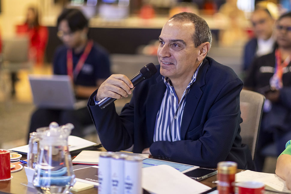 Raef Labaki assessing one of the presentations at the Grand Finale of NYIP