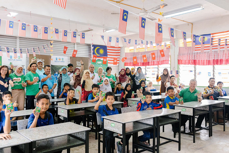 Students of SK Panggong experiencing the new classroom furniture