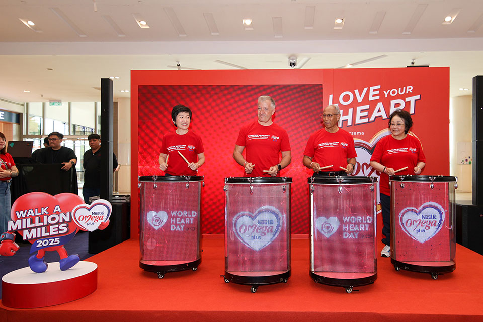 Distinguished guests performing the symbolic heartbeat rhythm