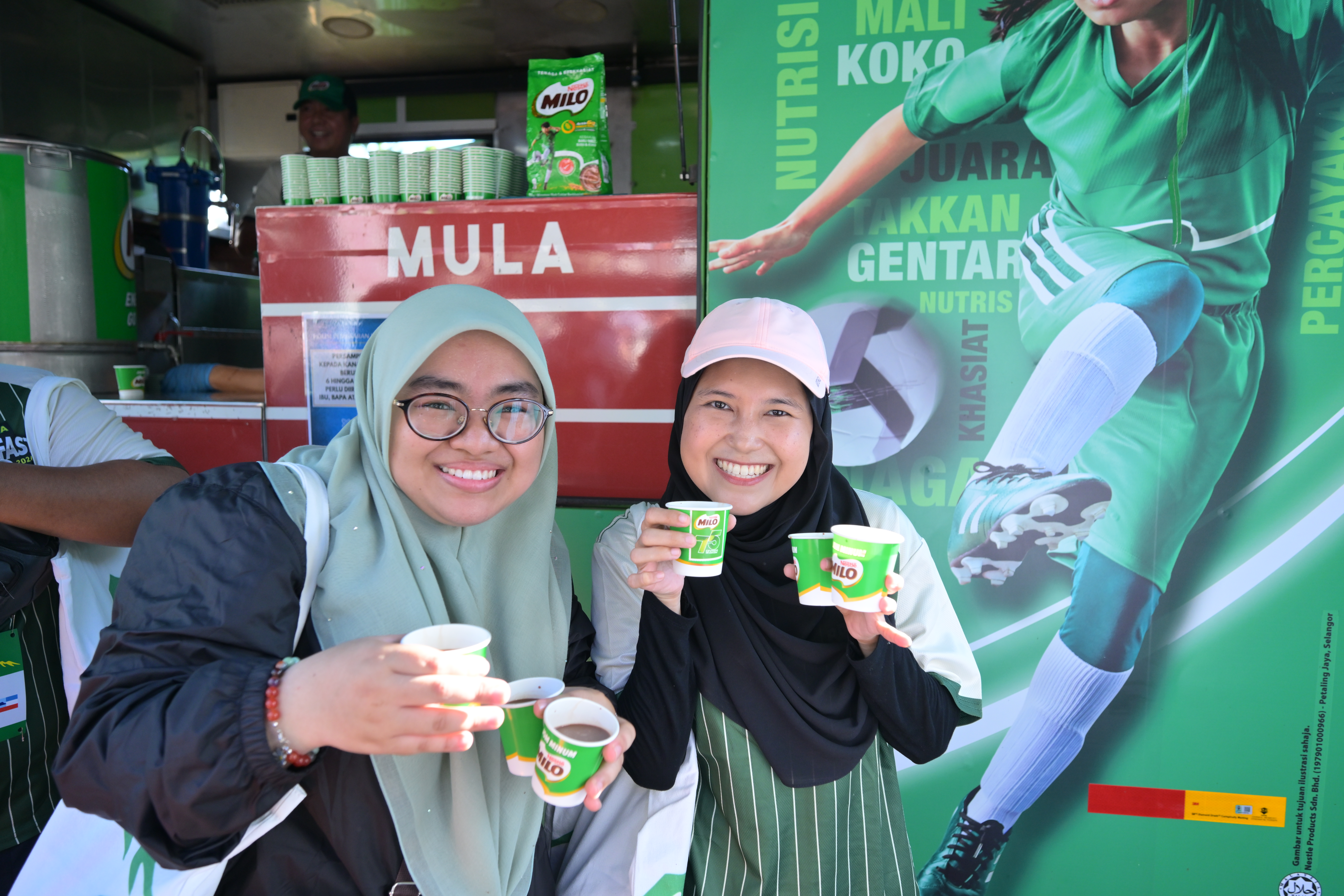 Participants enjoying their favourite cups of MILO