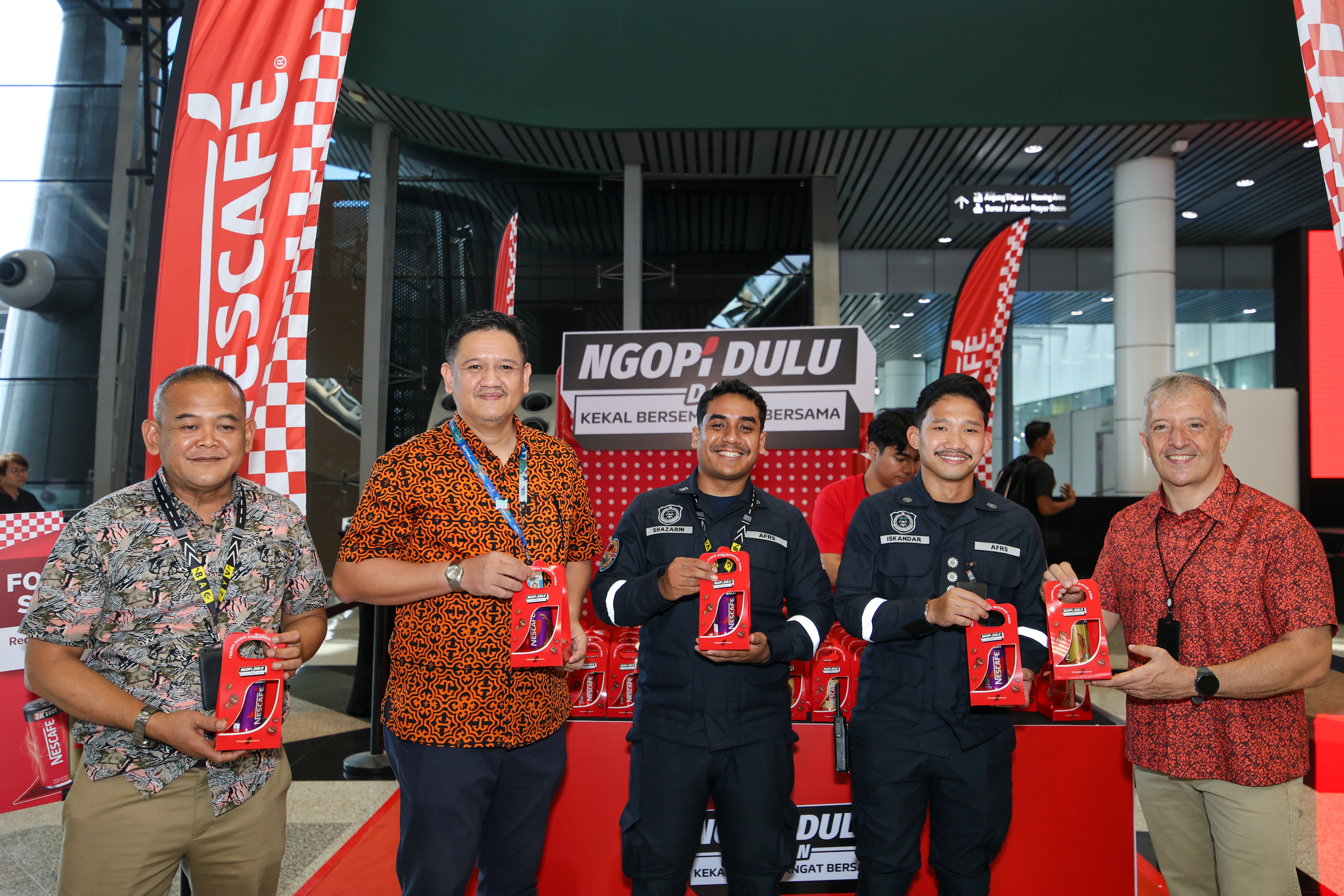 energized personnel receiving their complimentary NESCAFE