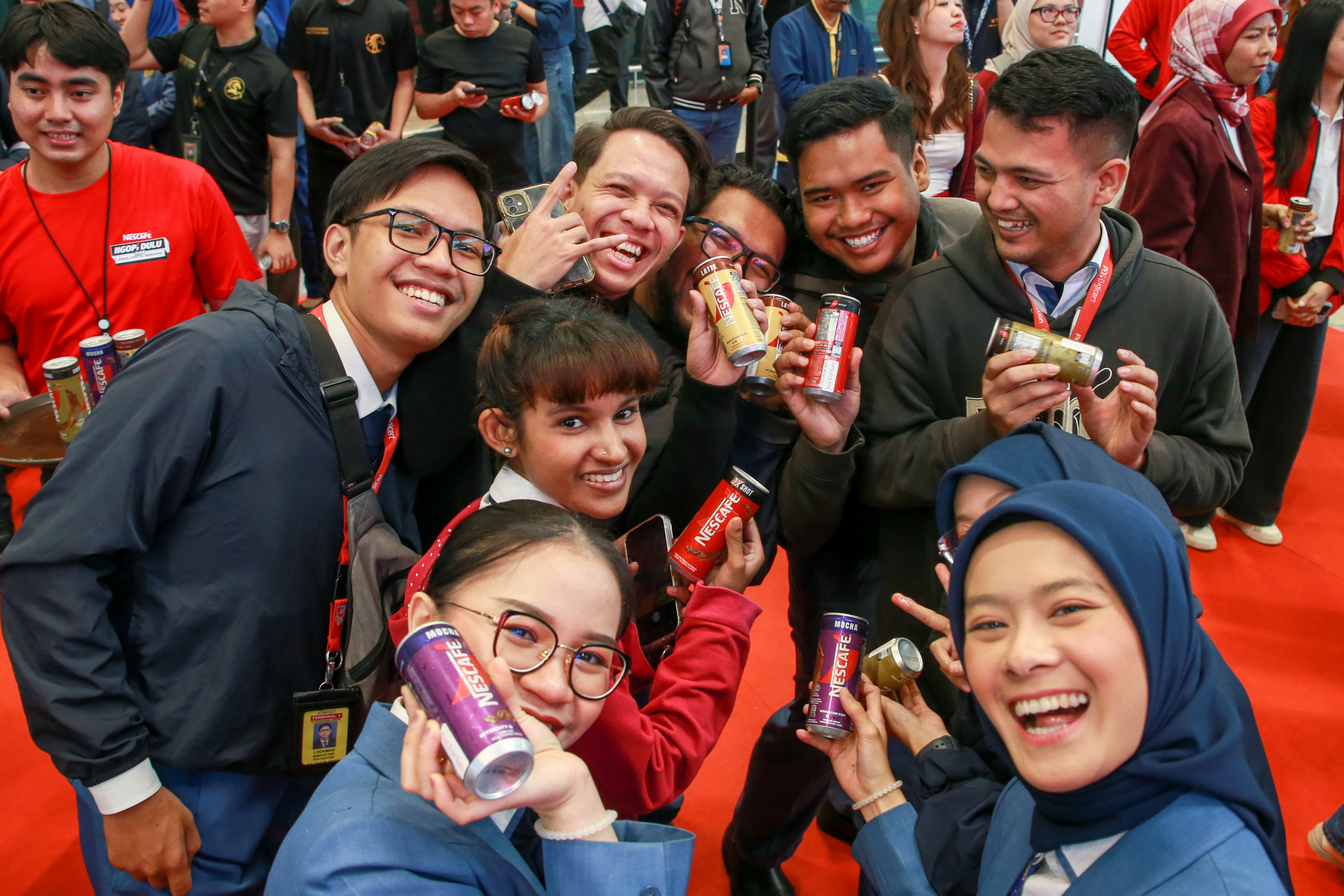 Joyful and energized personnel receiving their complimentary NESCAFE