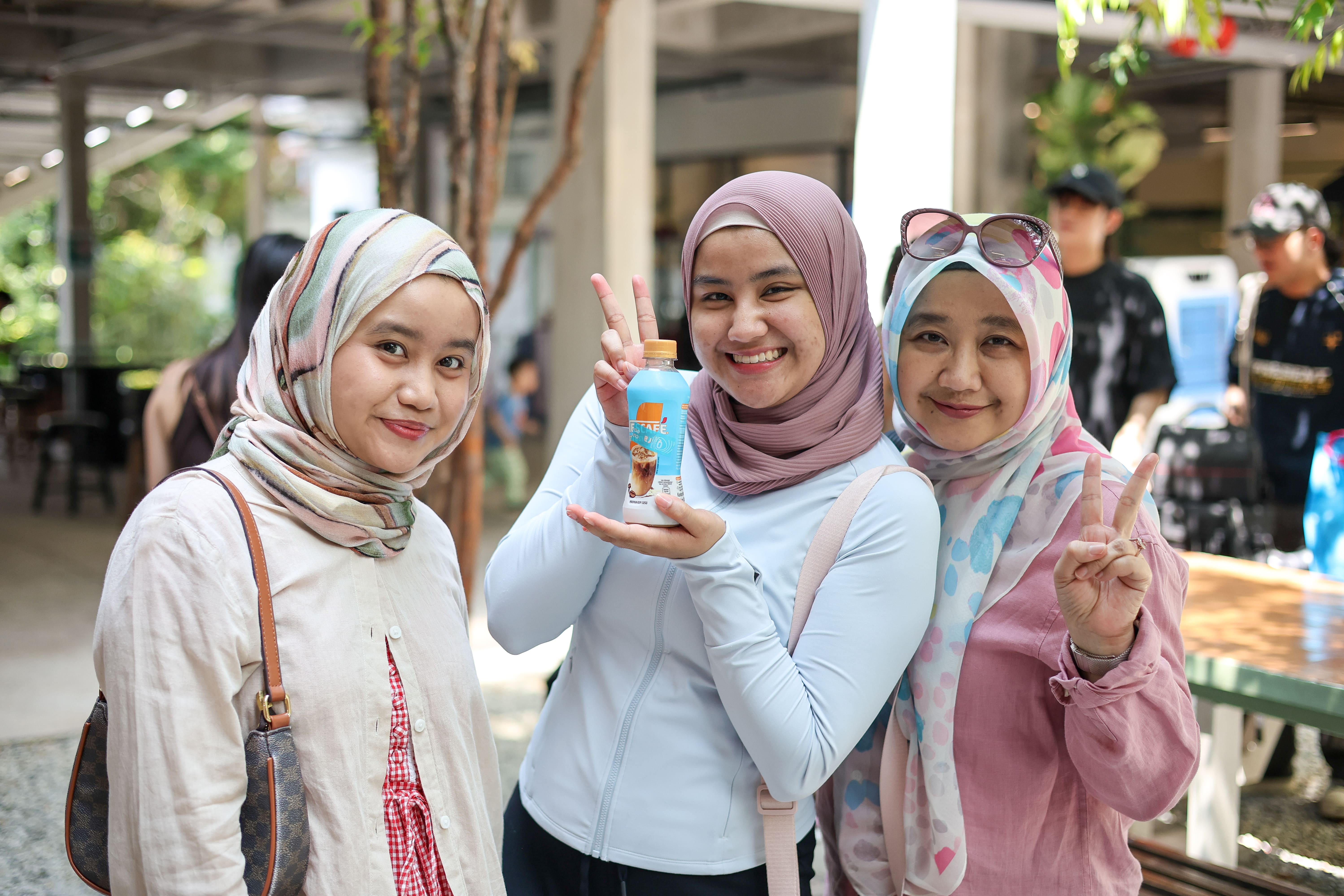 3 smiling women enjoying their nescafe drink