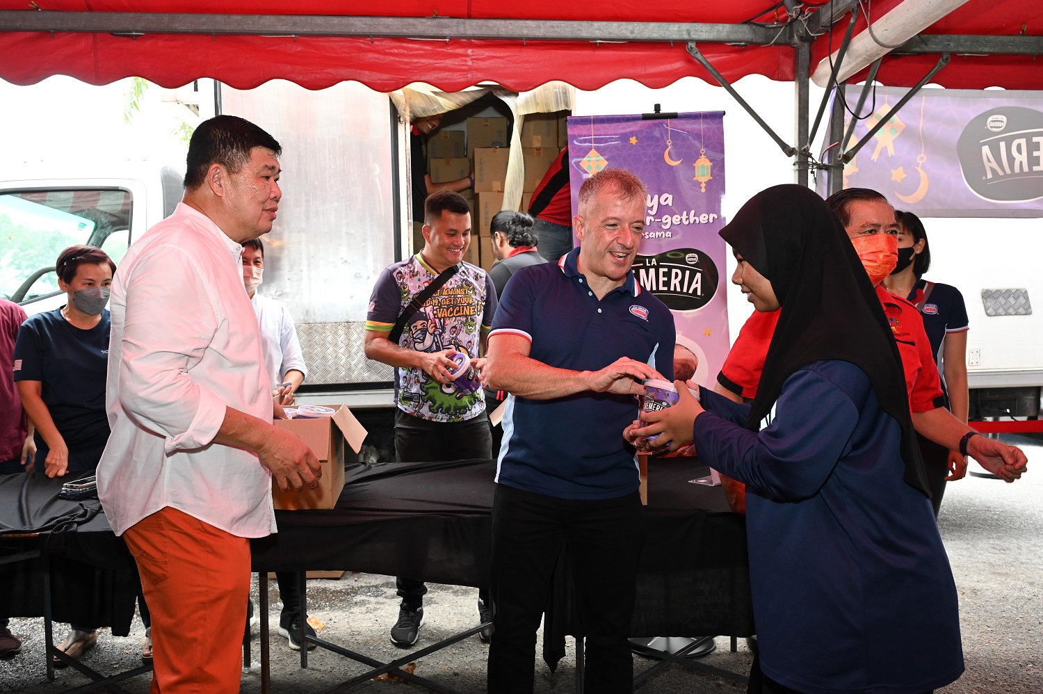 handing out pints of Nestlé LA CREMERIA Chocolate Brownie Fudge & Butter Cookies Ice Cream to more than 2,000 families