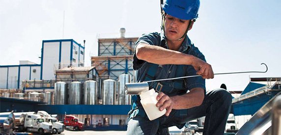 man taking water sample