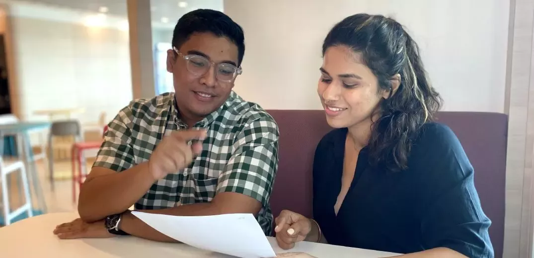 two colleagues reading